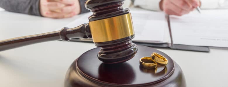 HandsOfWifeHusbandSigningDecreeOfDivorceDissolutionCanceling